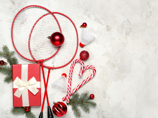 Badminton rackets with shuttlecocks, Christmas decor and gift on